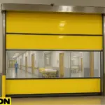 A Paylon vinyl roll-up door installed in a hospital hallway, illustrating effective quarantine zone separation with vinyl roll up barriers for infection control.