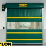 A green Roll-Up Vinyl Door manual installed in a clean medical facility, designed for quick isolation and hygiene control in quarantine or biosecure zones.
