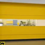 Paylon roll-up door system provides smart separation for research spaces, creating a clean, visible barrier between university lab zones with vibrant yellow fabric and built-in clear viewing panel
