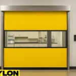 Roll-Up Vinyl Door – Motorized unit installed in a clean, lab-ready research facility, providing controlled access and flexible partitioning