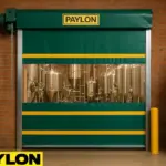 Roll-Up Vinyl Door – Motorized model by Paylon, featuring a green and yellow high-speed door with a clear vision panel in a brewery facility with stainless steel tanks