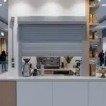 “Coffee shop counter with grille Roll Up Counter Door providing visibility and airflow while maintaining security”