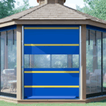 Gazebo fitted with a blue roll up vinyl door with yellow stripes to help control wind, rain, and insects