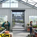 Roll Up Bug Door installed in a greenhouse entrance to keep pests out while allowing sunlight and fresh air into the workspace.