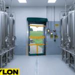 “Roll Up Bug Door installed in a production line workspace to improve ventilation and help keep contaminants out of processing zones.”