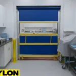 Blue roll-up vinyl door inside a medical storage room with carts and organized supplies
