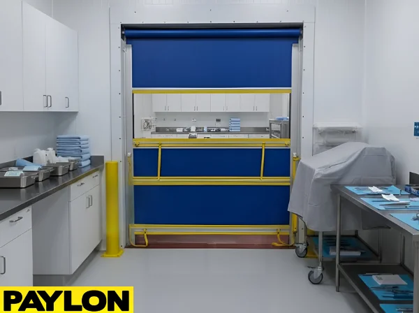 Blue roll-up vinyl door inside a medical storage room with carts and organized supplies
