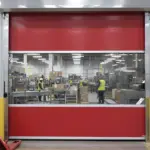 Roll-up vinyl door supporting smooth movement between warehouse aisles in a distribution center environment
