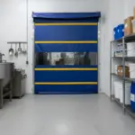 Roll-up vinyl door used in a dairy farm washdown and equipment handling area with frequent access