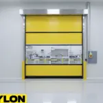 Yellow roll up door installed at clean room material transfer opening