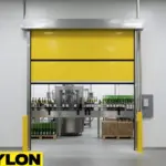 Yellow vinyl roll-up door installed over a winery bottling area, allowing safe movement of bottles and machinery.