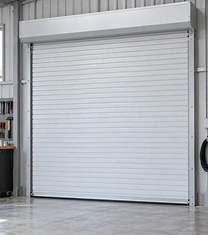 Insulated steel roll-up door on a heated workshop opening