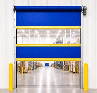 Blue motorized roll-up vinyl door with a clear vision panel and side motor in a warehouse